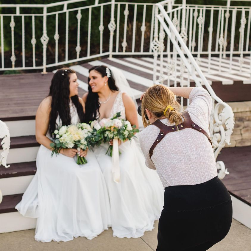 wedding photographer photographs two brides on their wedding day at the Pavillion in Kansas City Missouri. 