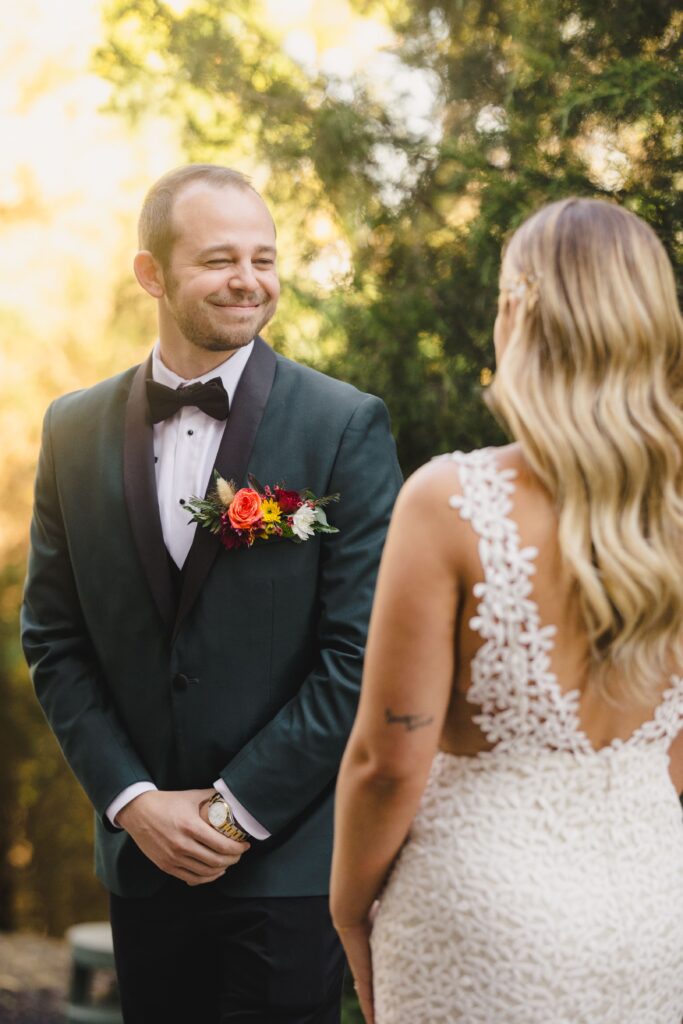 Bride and groom doing a first look captured by their Kansas City wedding photographer. 