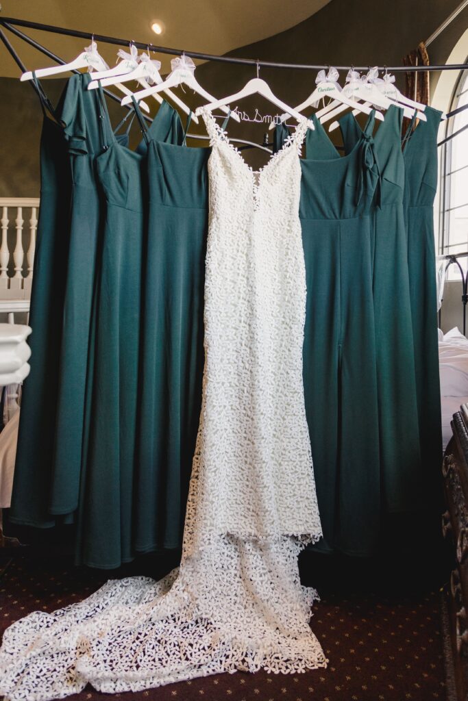 Bridal gown and bridesmaid dresses hung in the bridal suite at Avent Orangery.