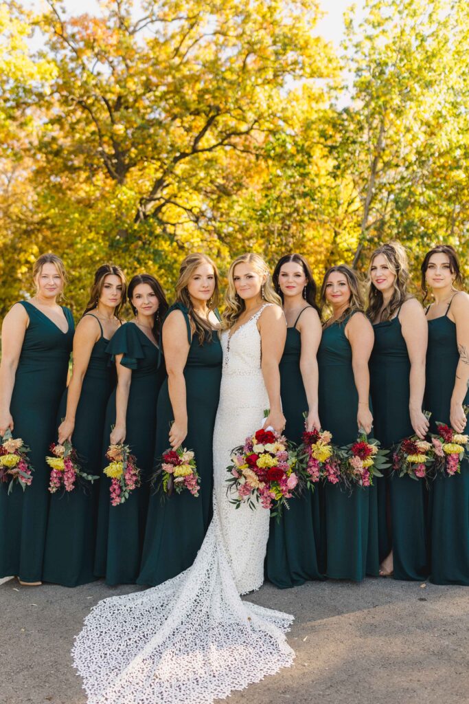 Bride and bridesmaids posing with their bouquets during their bridal party photoshoot.