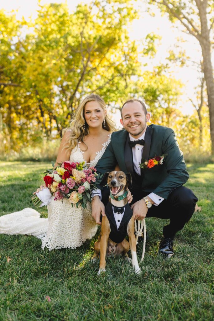 Bride and groom posing with their dog during their photoshoot with their Kansas City Wedding Photographer. 