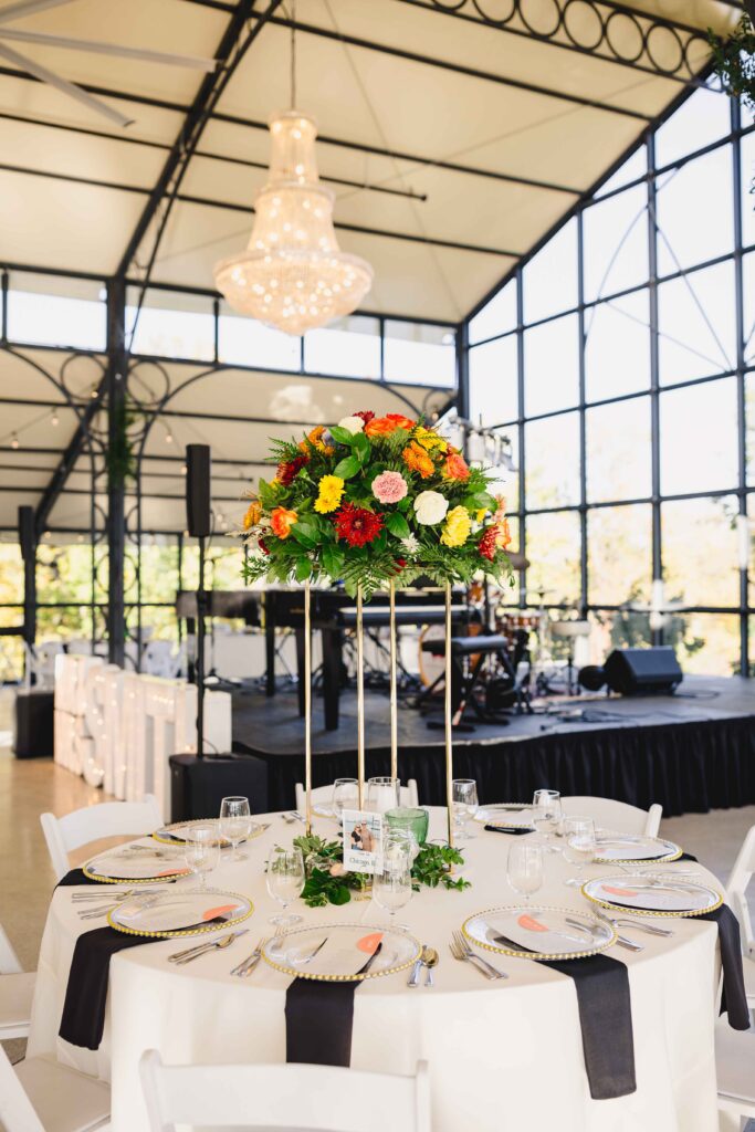 Table details and florals at a luxury wedding reception.