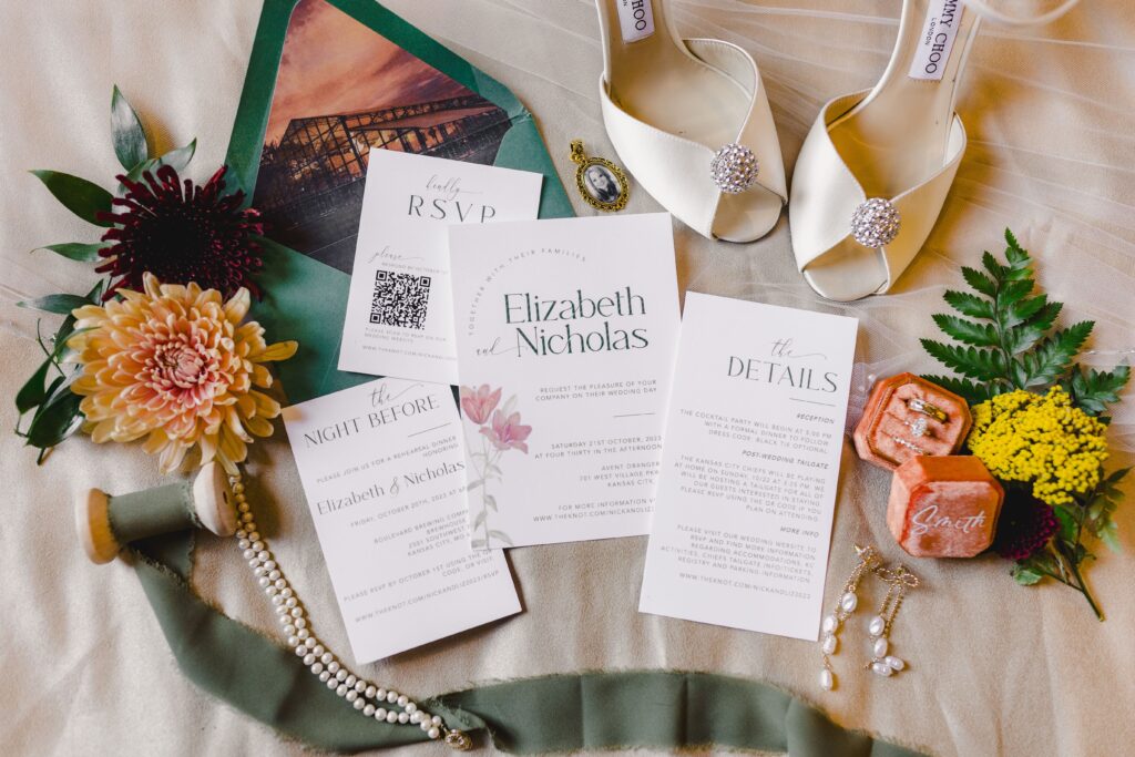 Wedding detail shot including bridal shoes, rings, stationary, wedding florals, and more captured by a Kansas City Wedding Photographer.