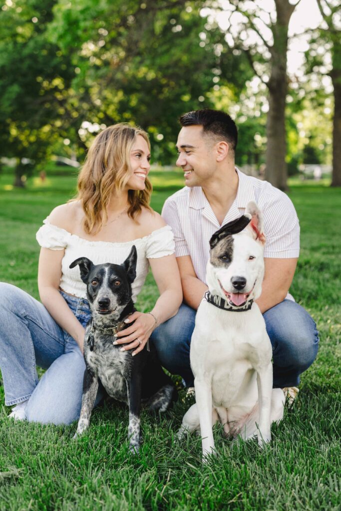 Couple photography at a park with their two dogs.