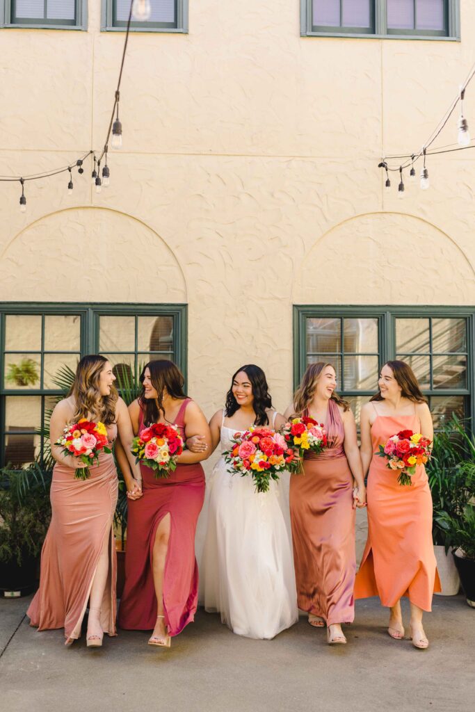 Bride and bridesmaids laughing and smiling at La Villa in Kansas City.