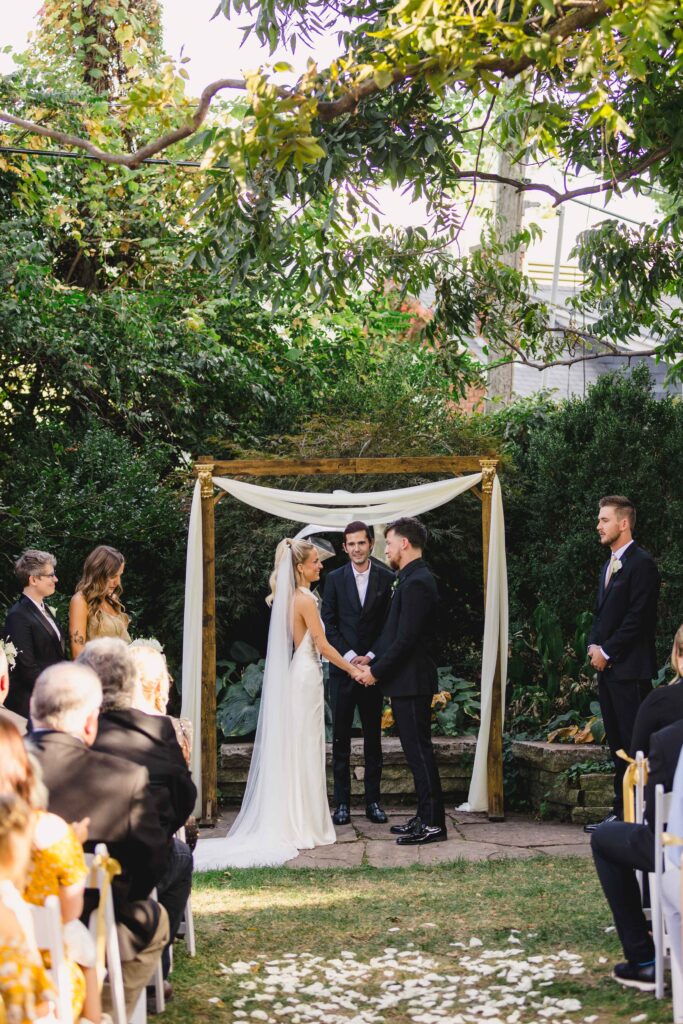 Bride and groom getting married at the Simpson House, one of the best Kansas City wedding venues.