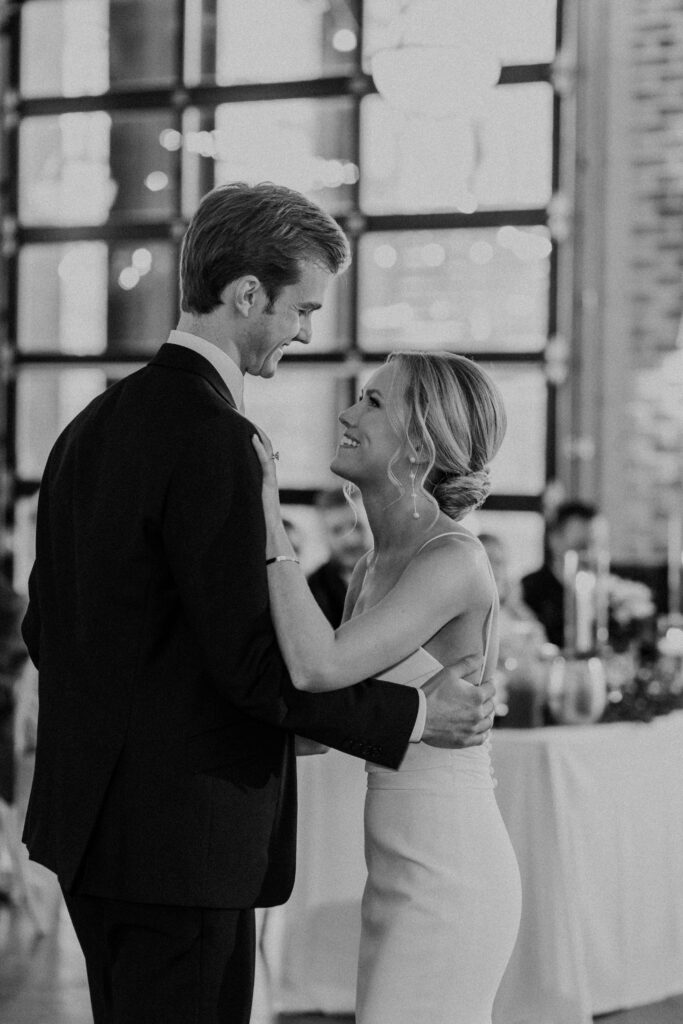 Bride and groom sharing their first dance, intimately captured by a Kansas City Photographer.