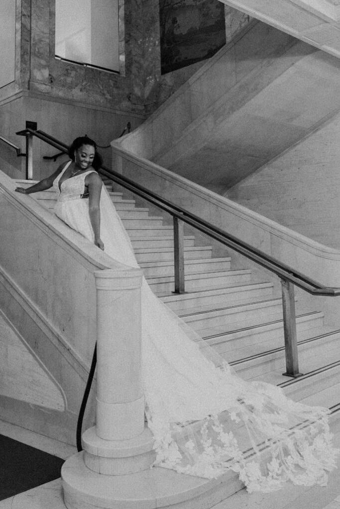 Bride posing along the steps of the museum.