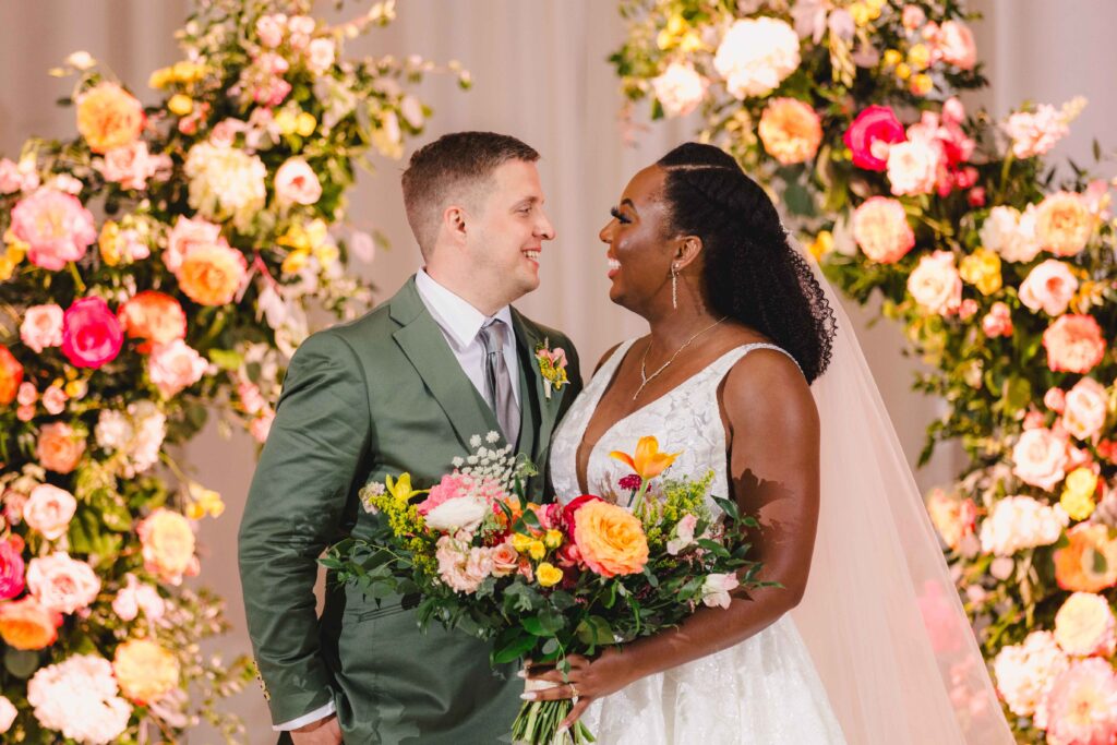 Bride and groom looking into each others eyes at the altar during their Nelson Atkins wedding.