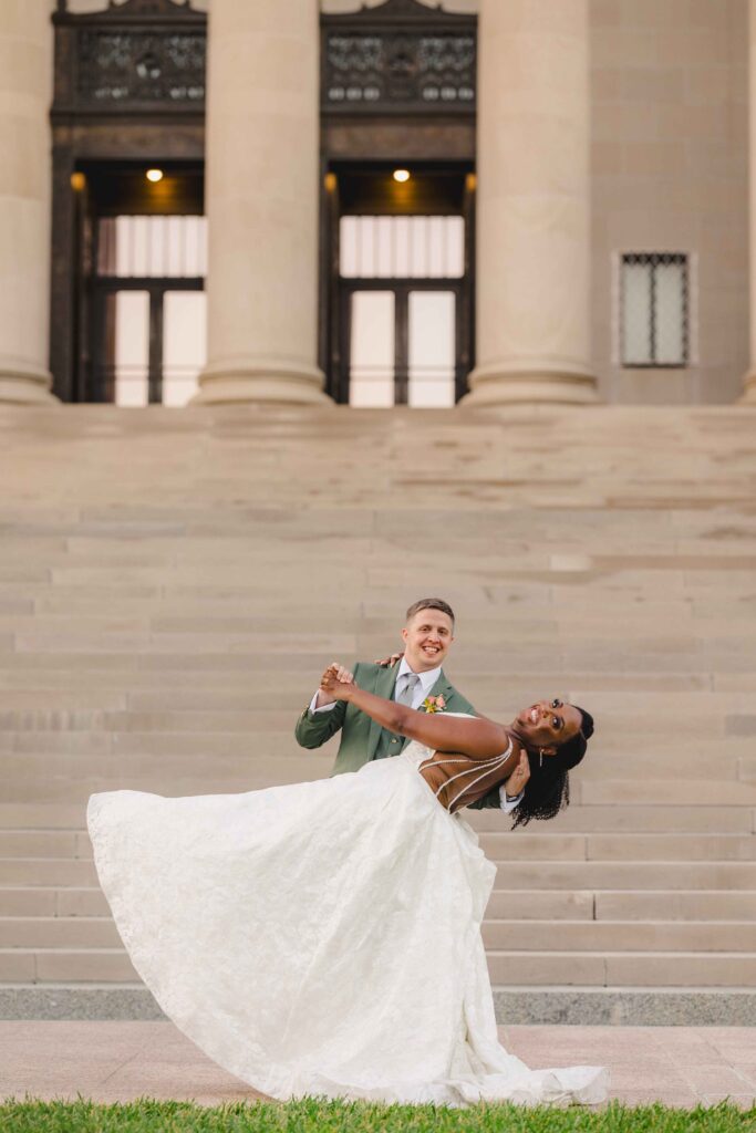 Groom playfully dipping the bride.