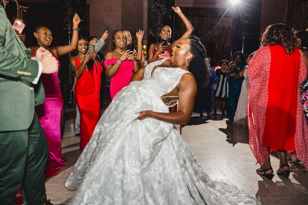 Bride dancing during their wedding reception at their Nelson Atkins wedding.