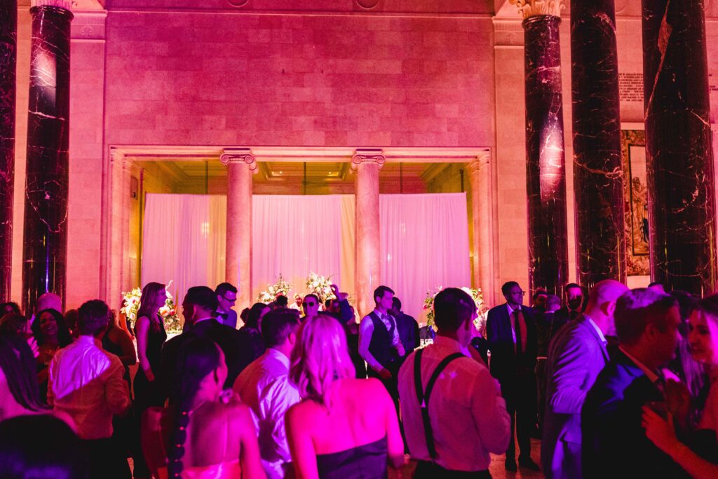 Nelson Atkins wedding lit up with pink lights. 