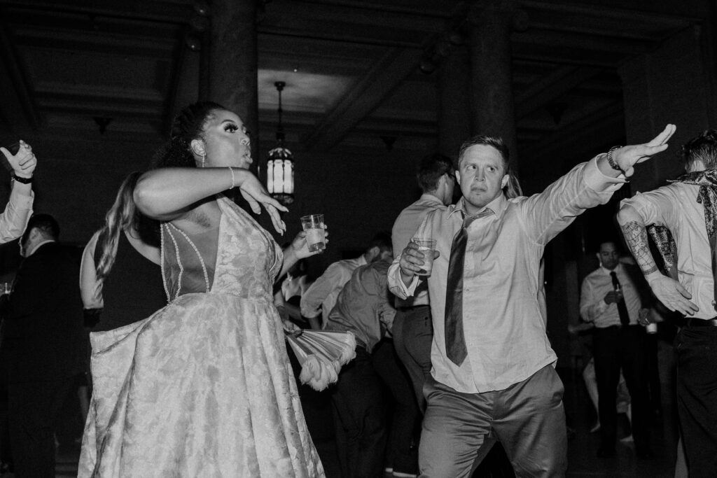 Bride and groom dancing on the dance floor at their Nelson Atkins wedding.