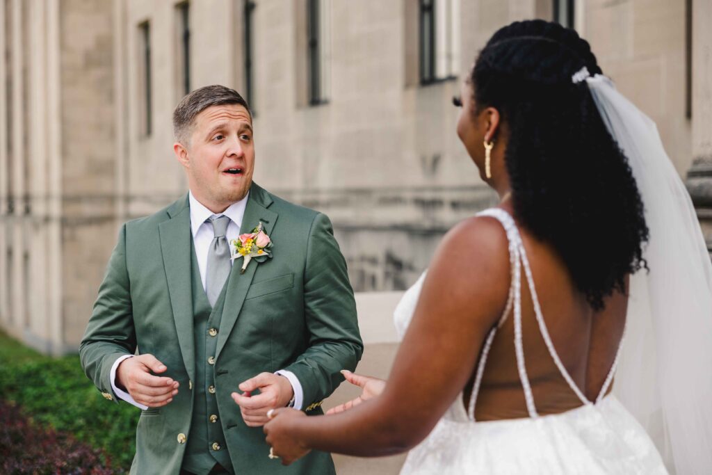 Groom turning around to see his bride for the first time.