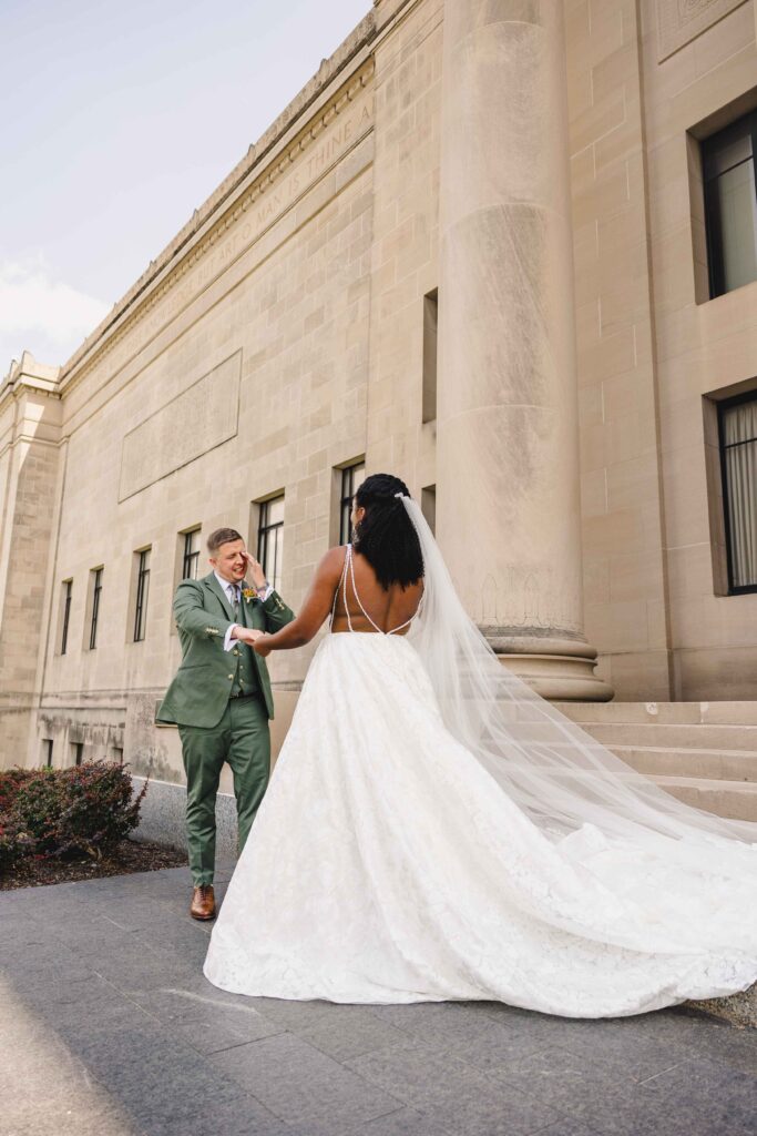 Groom crying as he sees his bride for the first time during their first look. 