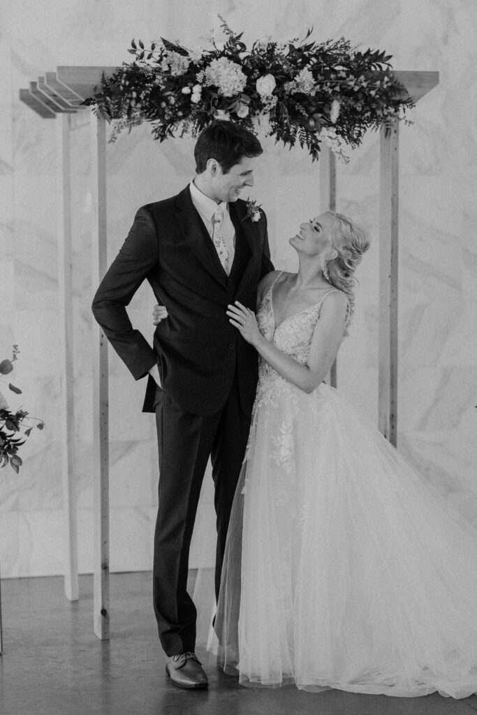 Bride and groom posing at the altar after their first look.