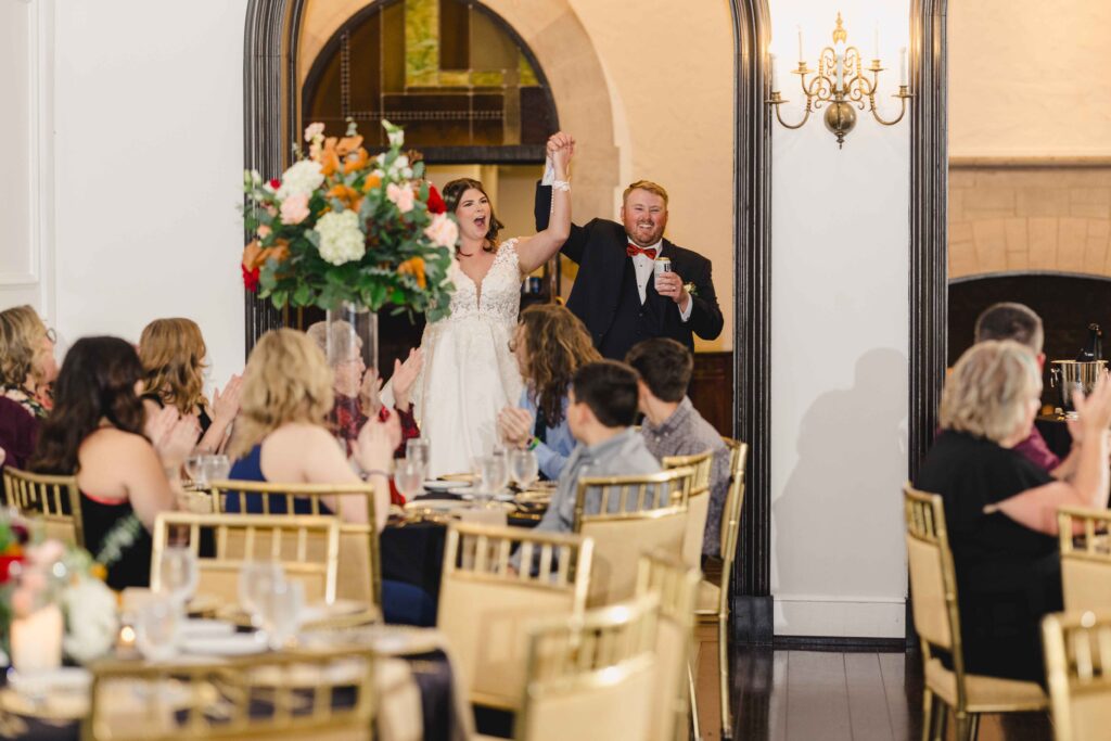 Newlyweds entering the wedding reception.