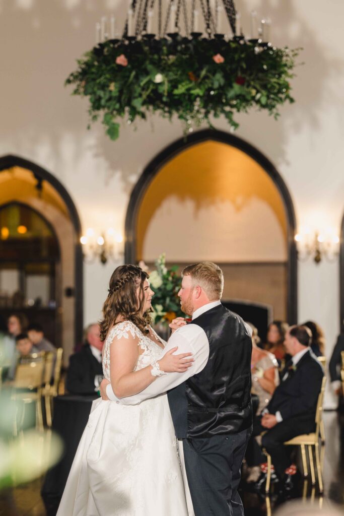 Newlyweds enjoying their first dance at their Oakwood Country Club wedding reception. 