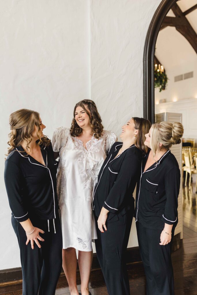 Bride and bridesmaids getting ready in pajamas. 