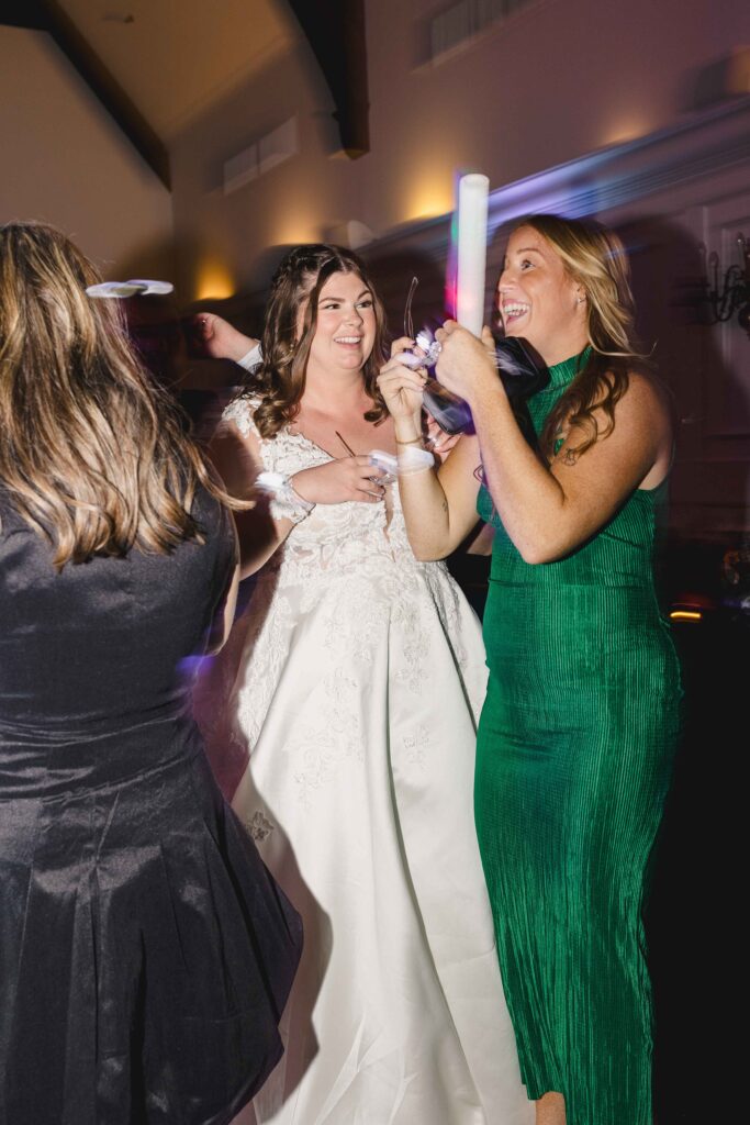 Bride and guests talking and dancing. 