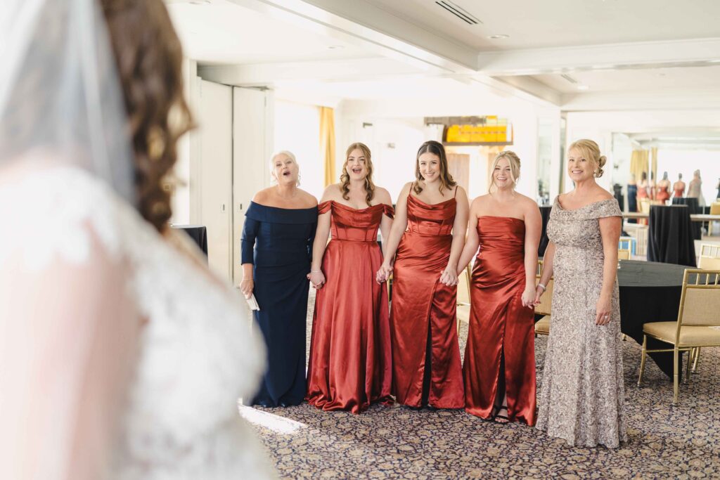 Bride having a first look with the bridal party. 