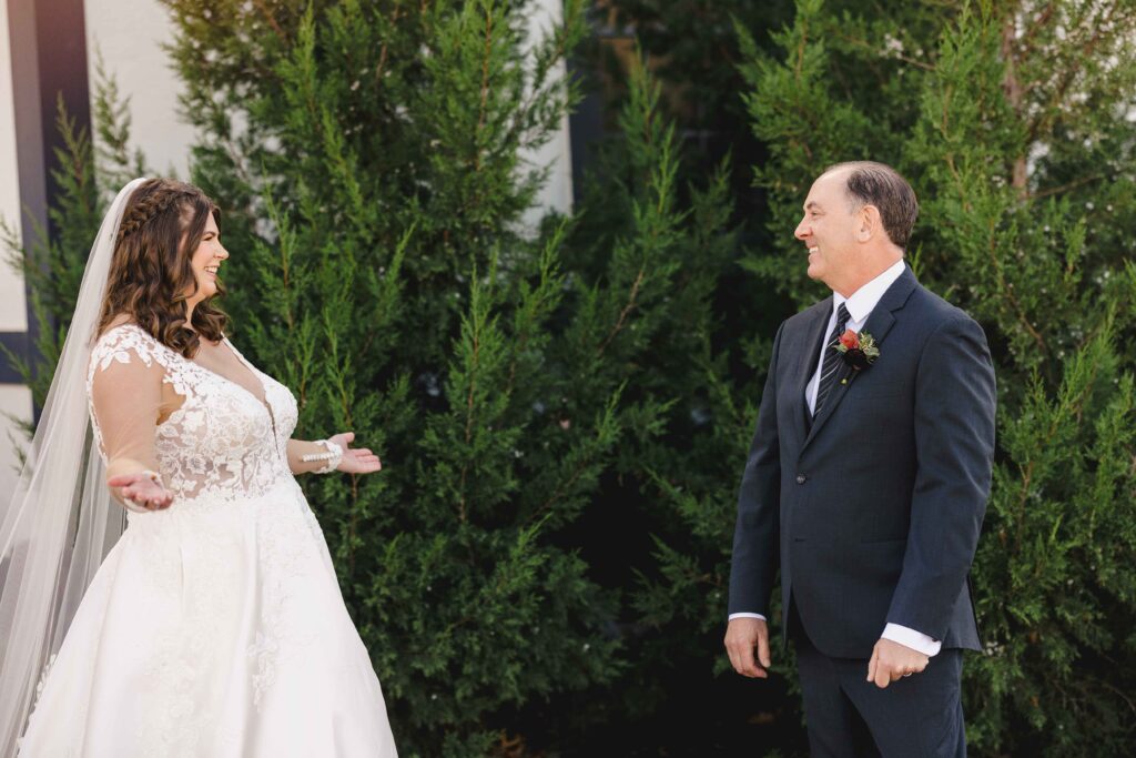 Dad seeing the bride in her wedding dress for the first time during their first look. 