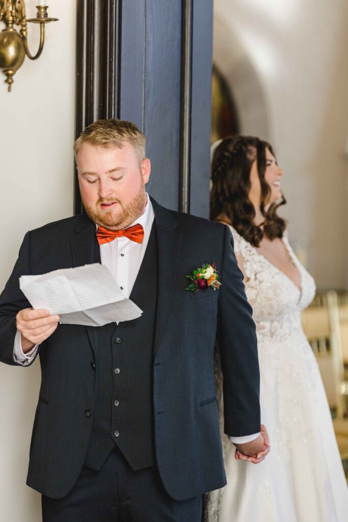 Groom reading a letter to his bride before the wedding ceremony.