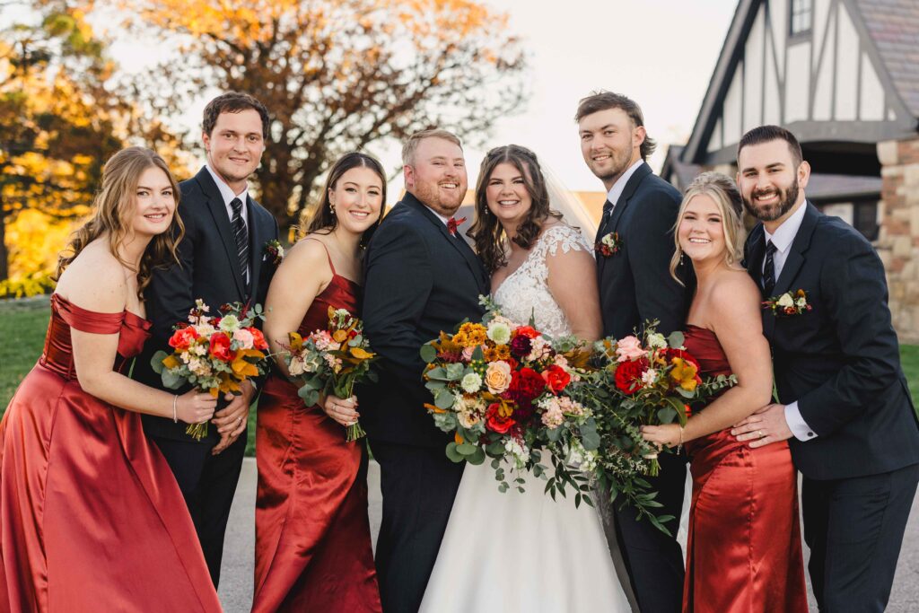 Wedding party smiling after the Oakwood Country Club wedding ceremony. 