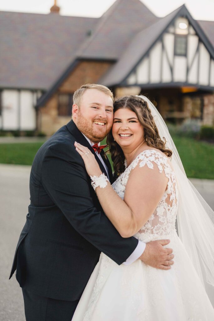 Bride and groom smiling really big after getting married. 