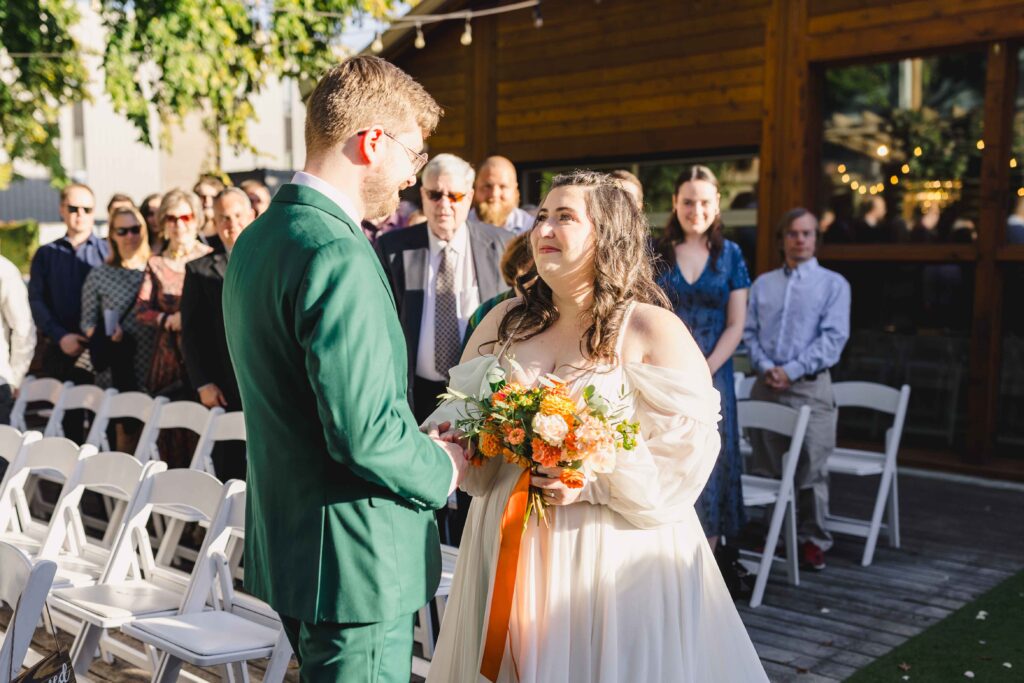 Bride and groom meeting at the wedding ceremony at The Magnolia Brookside.