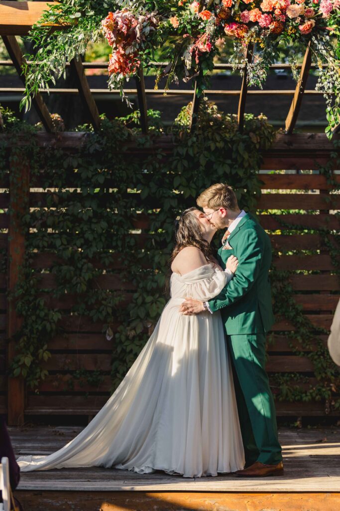 Bride and groom kissing after saying "I do" at The Magnolia Brookside.