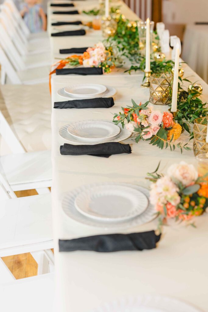 The reception tables at The Magnolia Brookside filled with bright florals. 