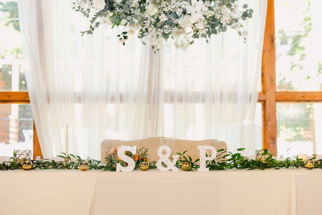 Beautiful decor for the sweetheart table at The Magnolia Brookside wedding reception. 