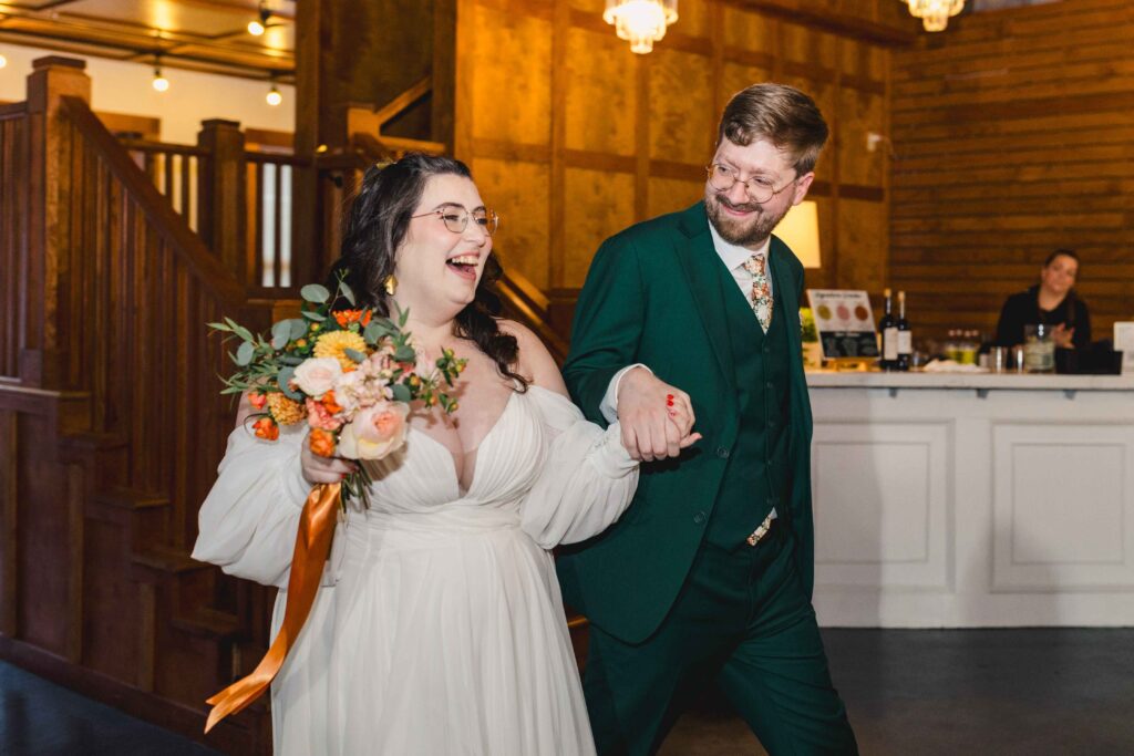 Bride and groom entering their wedding reception at The Magnolia Brookside.