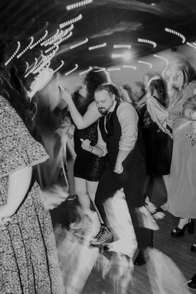 A wedding guest breaking it down on the dance floor at The Magnolia Brookside.