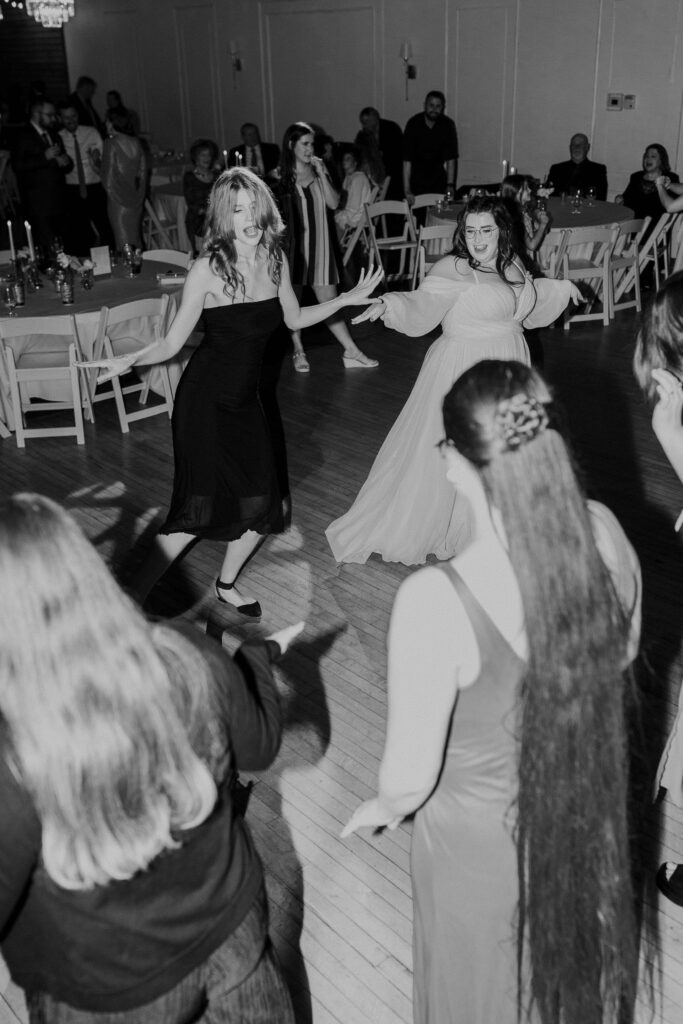 Guests dancing on the dance floor at this Kansas City wedding at The Magnolia Brookside.