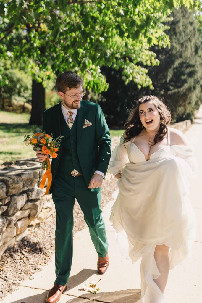 Bride and groom walking at Nelson-Atkins Museum of Art. 