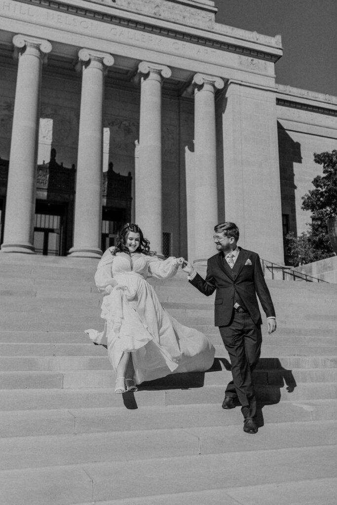 Bride and groom walking down the steps at the Nelson.