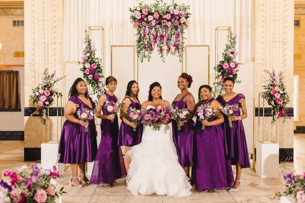 Bride and bridesmaids holding their wedding bouquets.