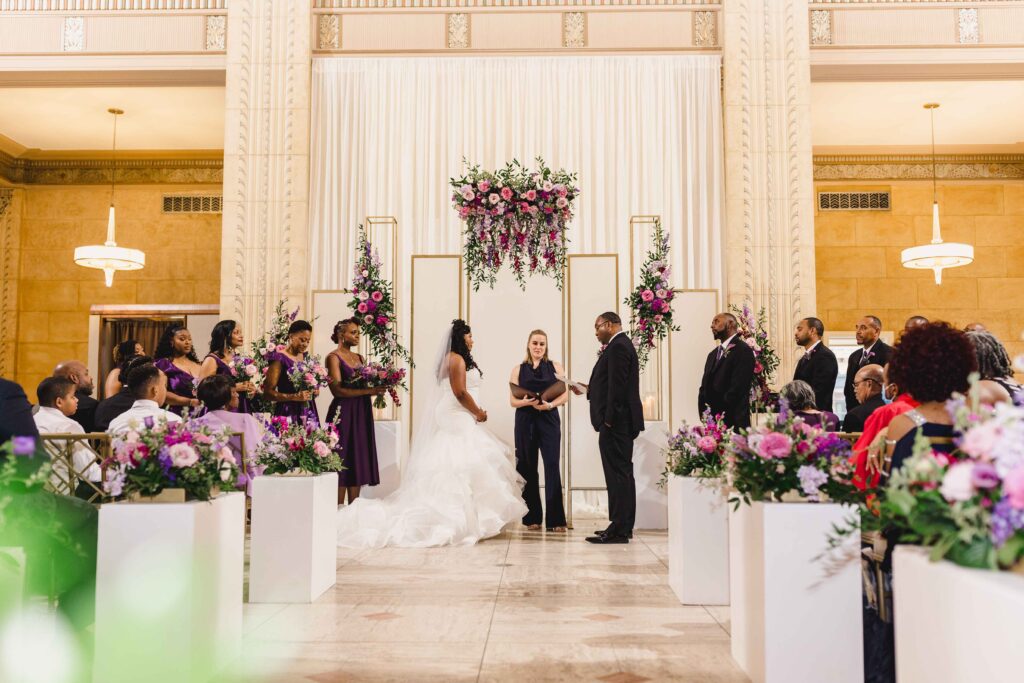 Bride and groom standing at the altar at their wedding ceremony at The Grand Hall at Power & Light.