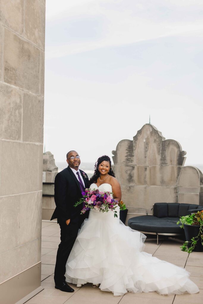 Bride and groom smiling at the rooftop of The Grand Hall at Power & Light.
