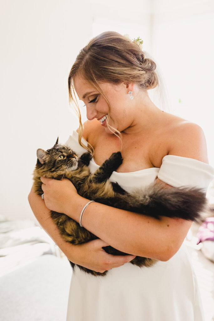 Bride holding her cat before the reception at The Guild KC.
