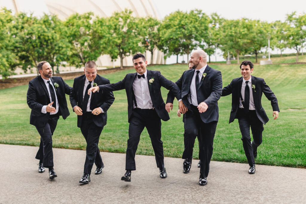 Groomsmen taking a funny picture.