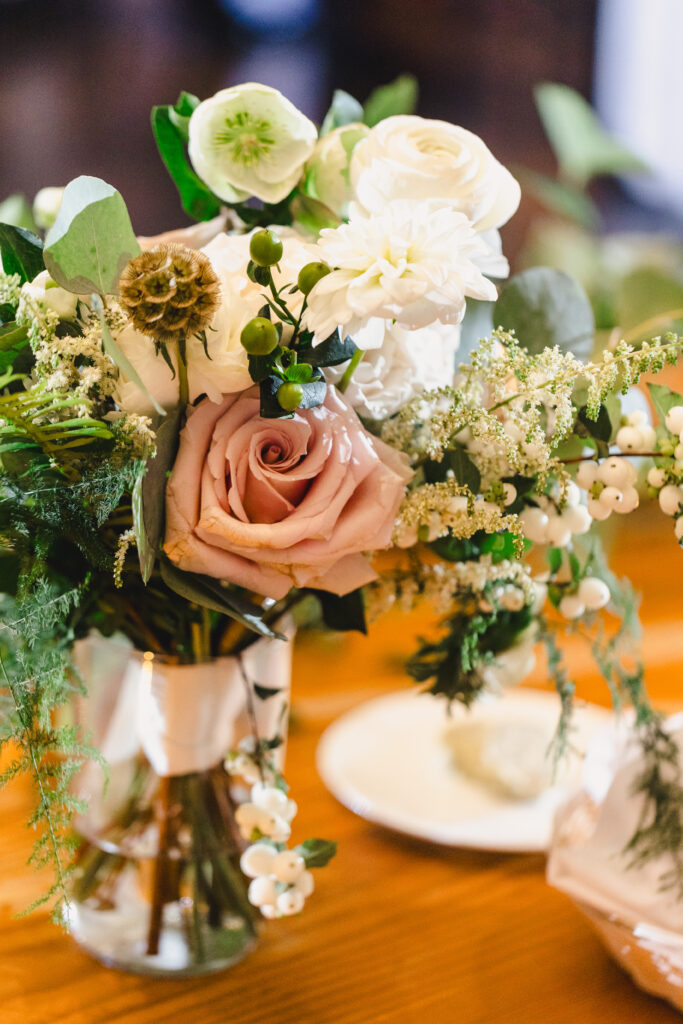 Wedding bouquet with pink roses and white flowers.
