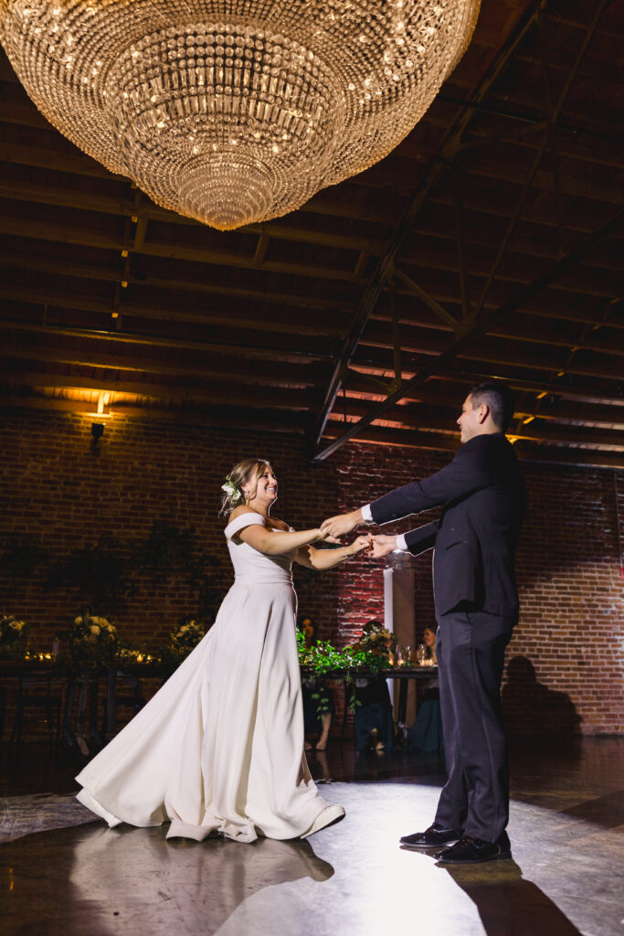 The newlyweds slow dancing at The Guild KC.