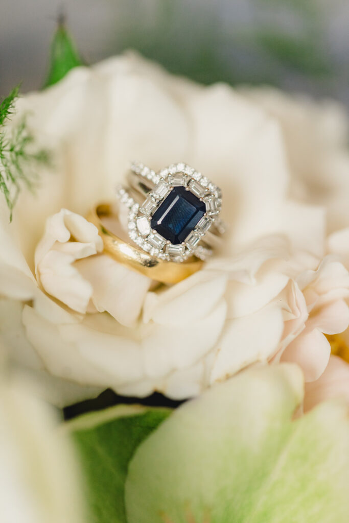 Close up of the wedding rings on a flower.
