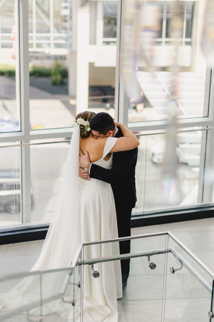 Bride and groom hugging during their first look.