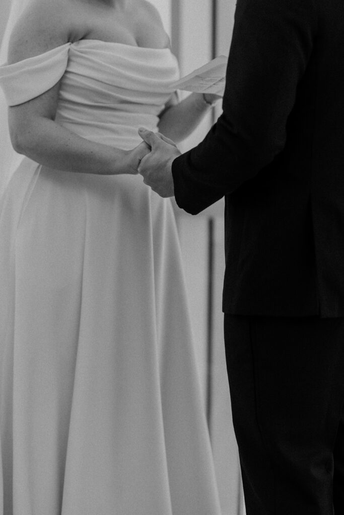 The couple holding hands before the reception at The Guild KC.