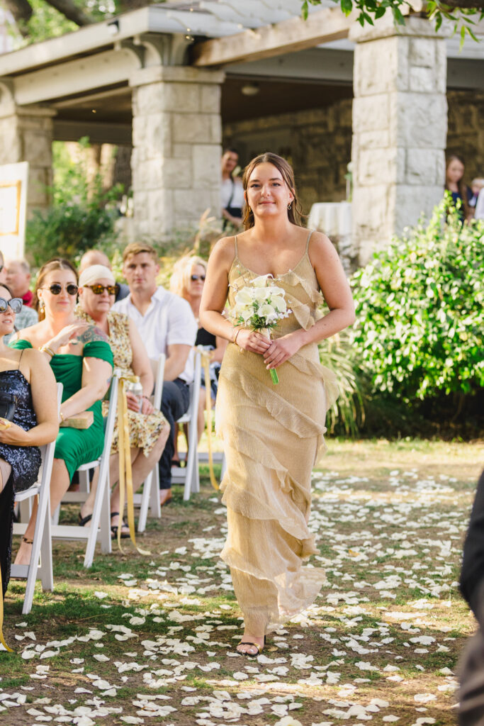 bridesmaid walking down the aisle
