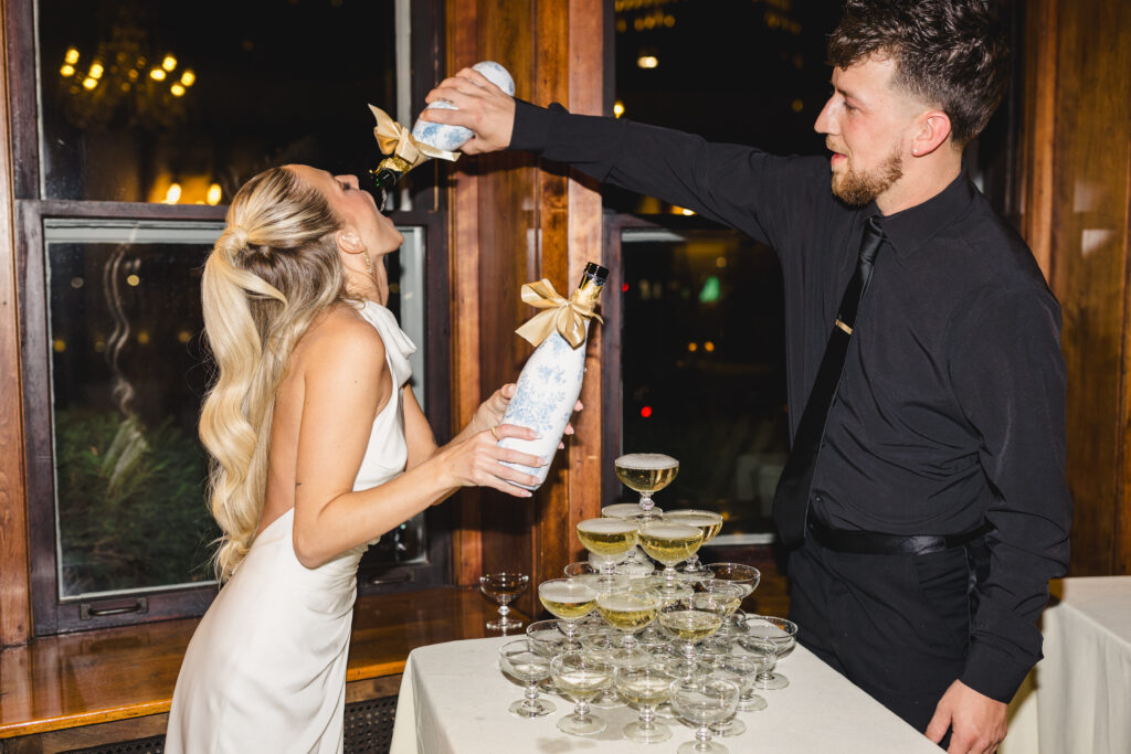 champagne tower with the bride and groom